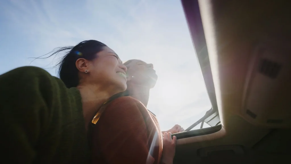 queer couple and sunroof